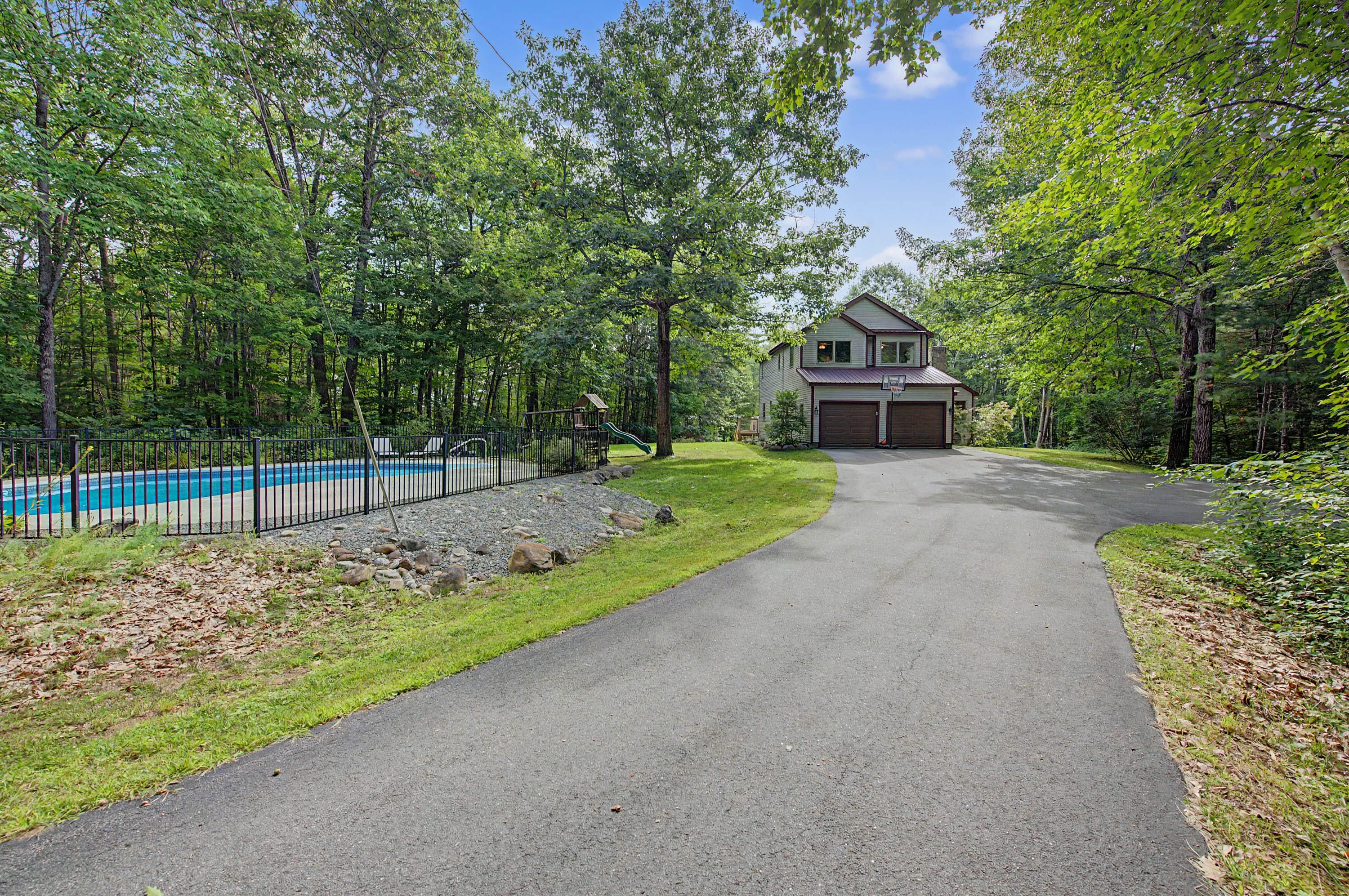 Privacy meets scenery in this breathtaking 4BR, 2.5 Bath contemporary saltbox nestled well back from