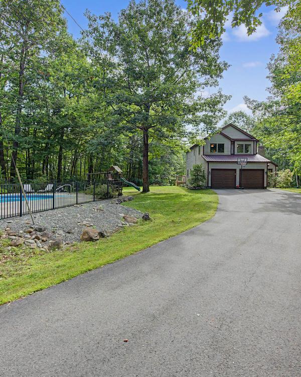 Privacy meets scenery in this breathtaking 4BR, 2.5 Bath contemporary saltbox nestled well back from