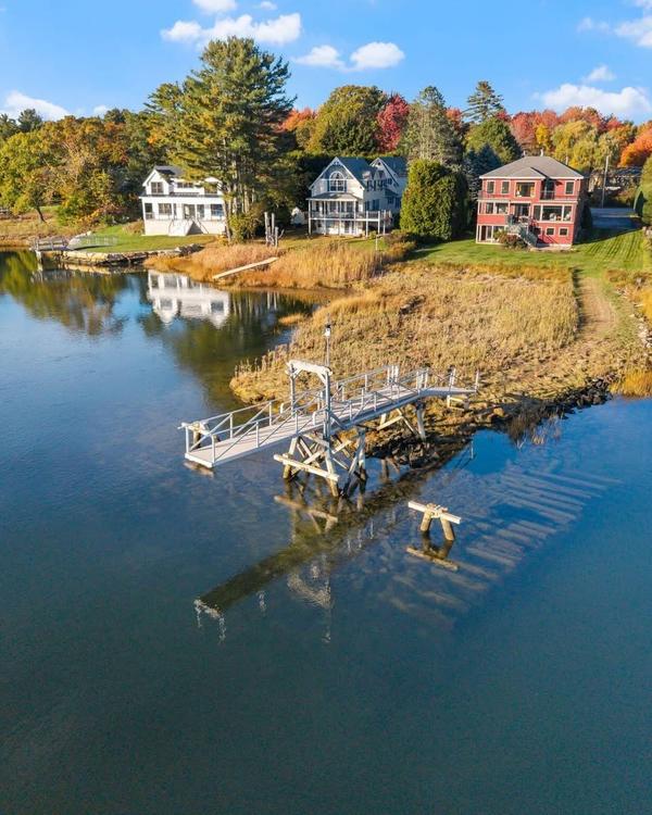 Your waterfront sanctuary awaits. This meticulously maintained home sits on .89 acres on a quiet dea