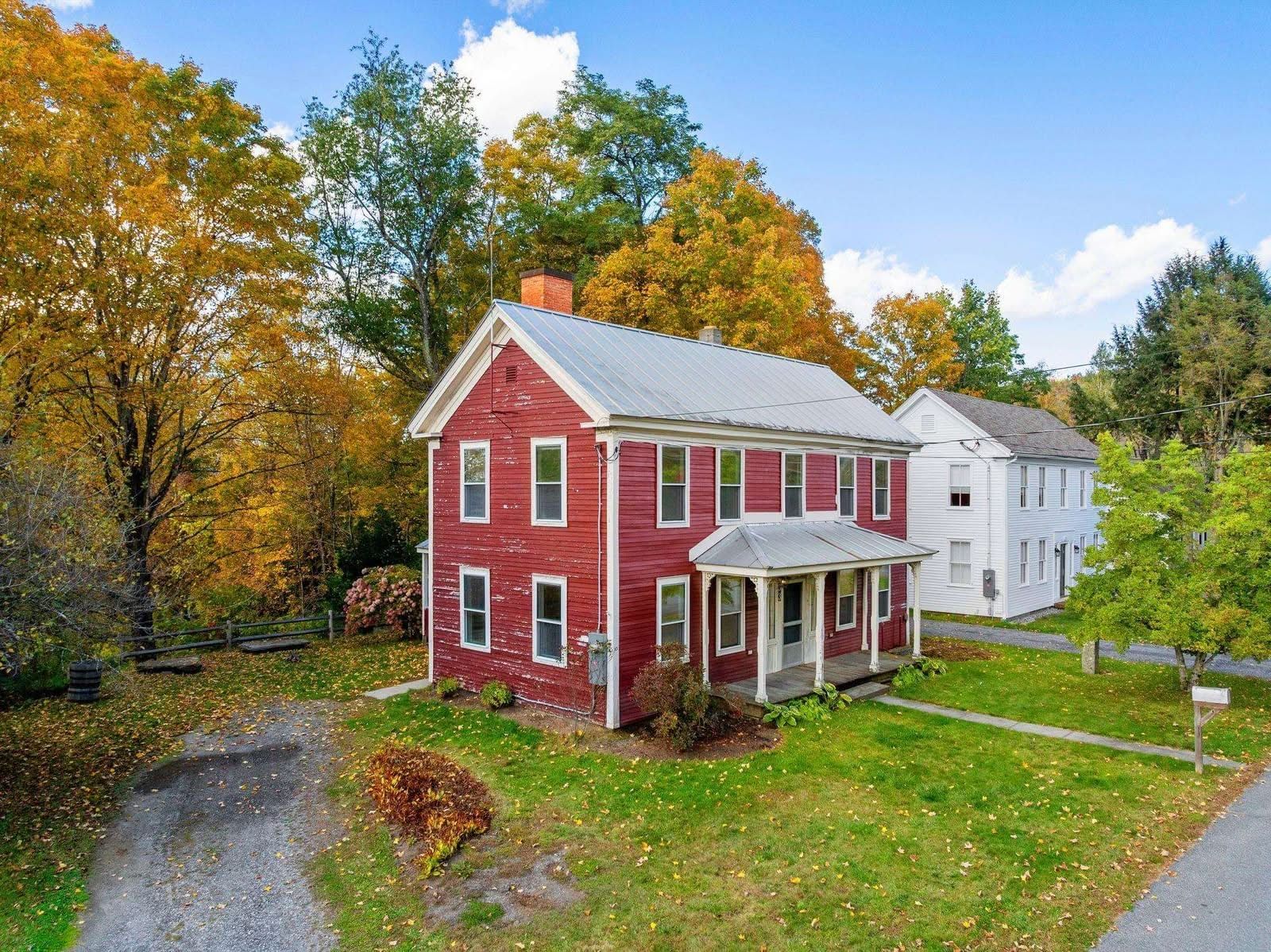 Set on a peaceful village lot with mature fruit trees including blueberry and raspberry bushes, this